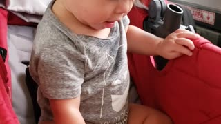 Jaxon cross country amtrak- playing in the bassinet