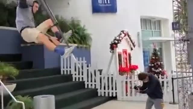 Guys Jumps Down Staircase on Pogo Stick and Falls to the Ground