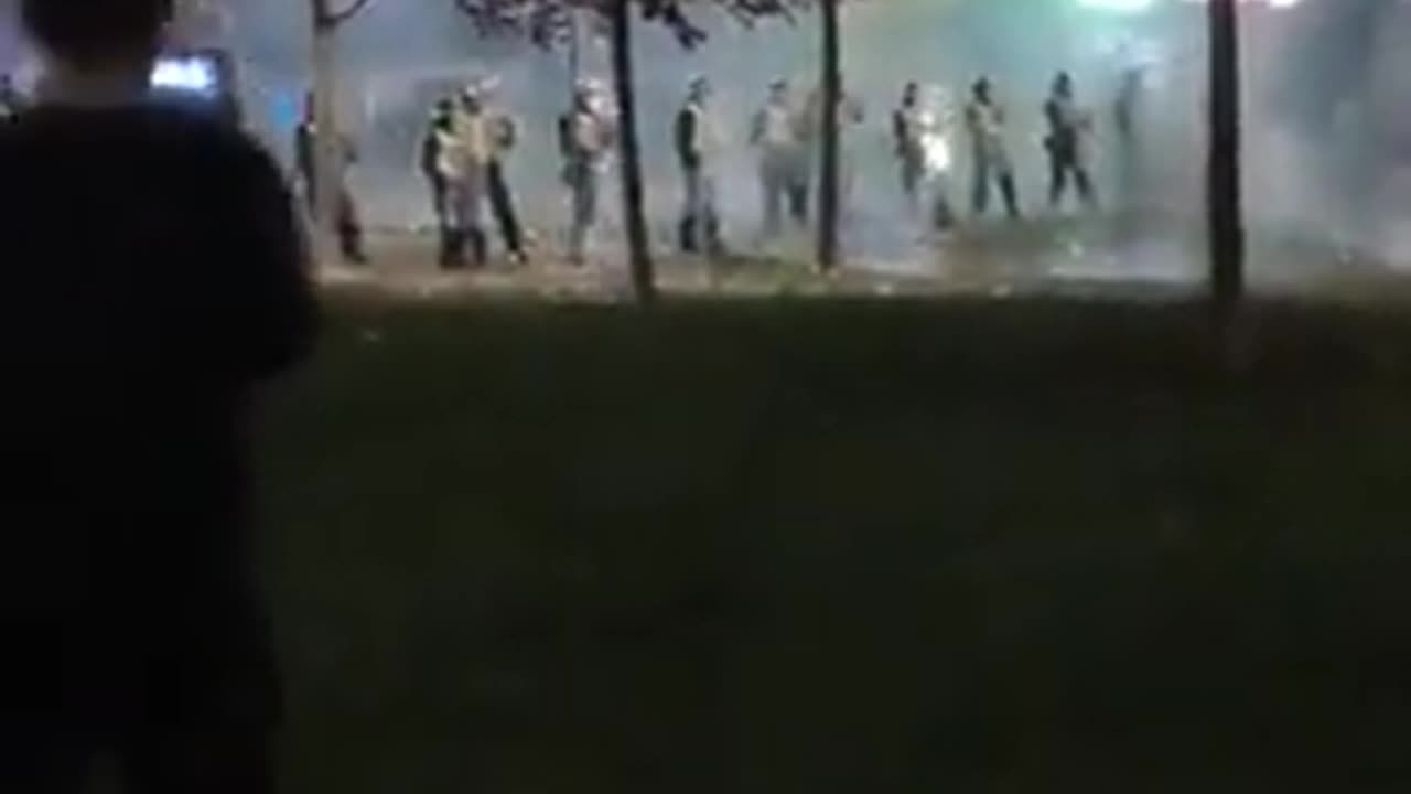 Petrol bombs and fireworks are being thrown at riot police in Edinburgh, Scotland