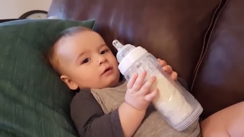 Cute Baby with Bottle