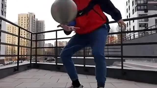 Guy Balances And Spins Two Basketballs On His Finger And Jumps Over Them