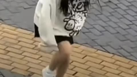 Cute Girl Dancing Crazy Frog under the rain