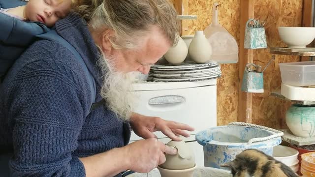 Cat Plays With Pottery Wheel