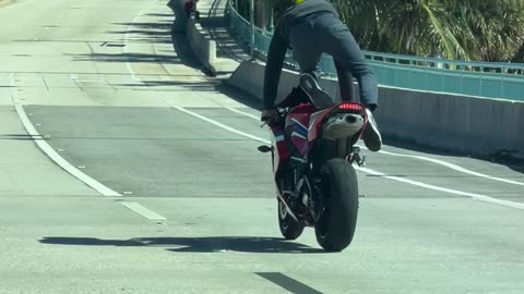 Standing Backward on a Moving Motorcycle