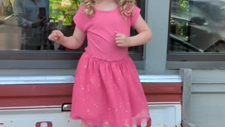 Layla Dancing outside birches on the beach.