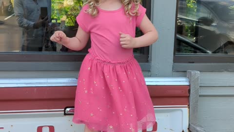 Layla Dancing outside birches on the beach.