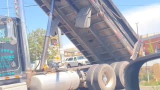 Semi-Truck Gets Stuck on Traffic Light Pole