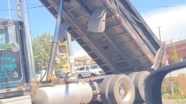 Semi-Truck Gets Stuck on Traffic Light Pole