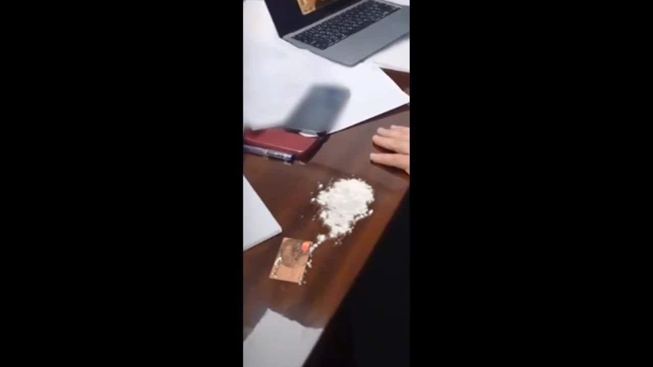 Volodymir Zelensky with a large pile of cocaine on his desk