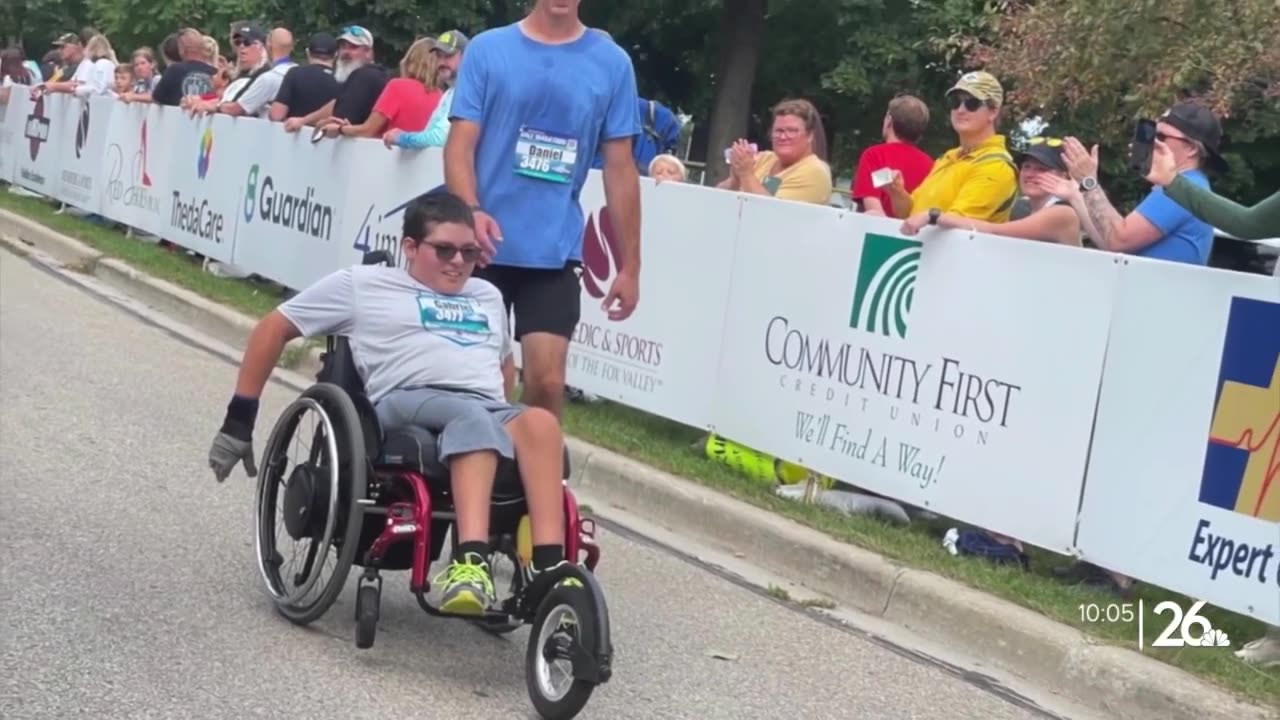 Spina bifida can't stop him from completing a marathon with his dad