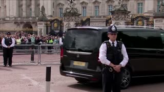 King Charles waves on return to Buckingham Palace