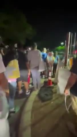 Why are the migrants wearing ankle monitors?