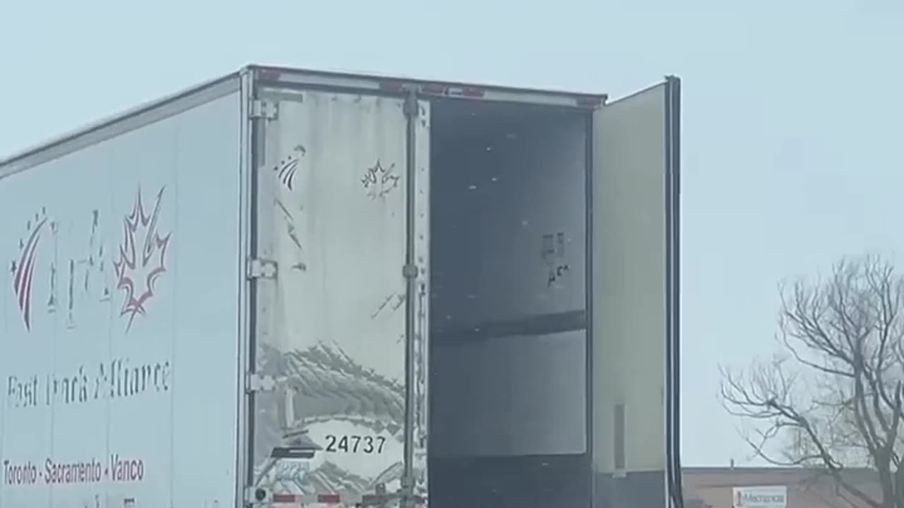 Trailer Doors Open On Highway