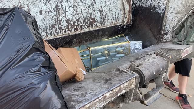 Garbage Truck Demonstrates Crushing Power