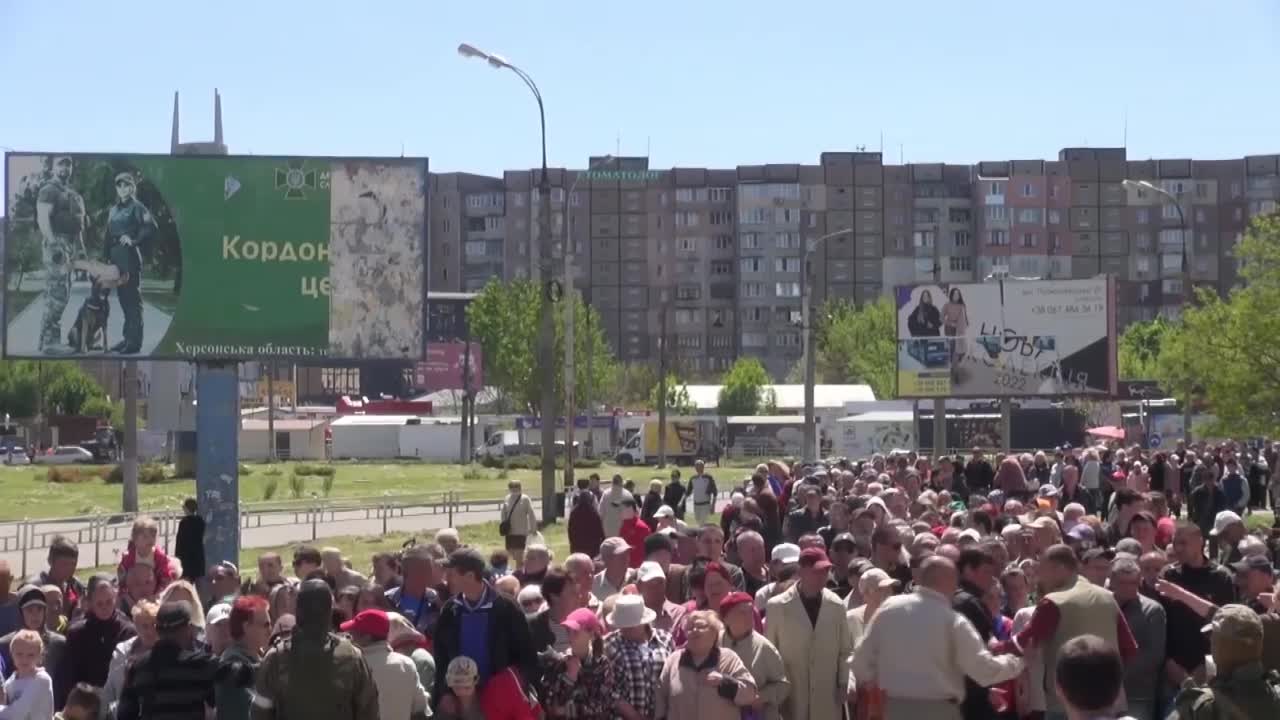 Russian servicemen organise humanitarian aid distribution in one of the residential areas of Kherson