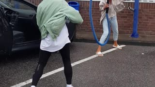 Face Meets Vacuum During Car Wash Dance