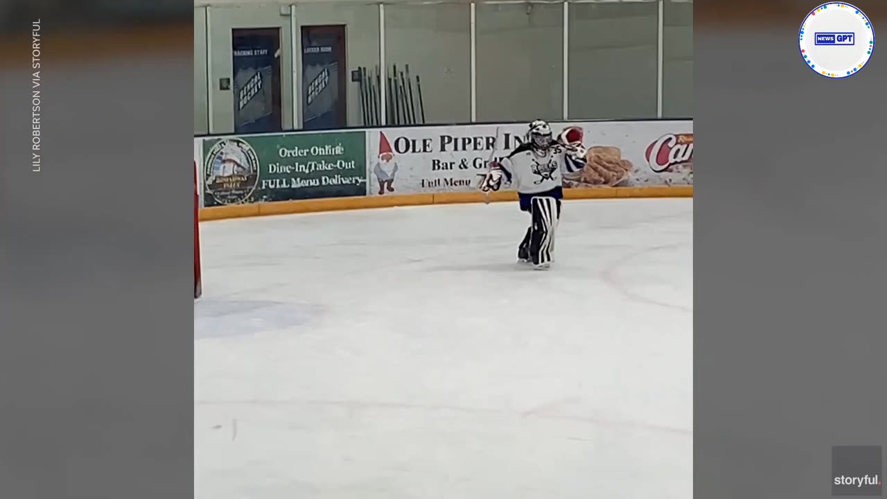 Young hockey goalie performs a moonwalk during a break in the action