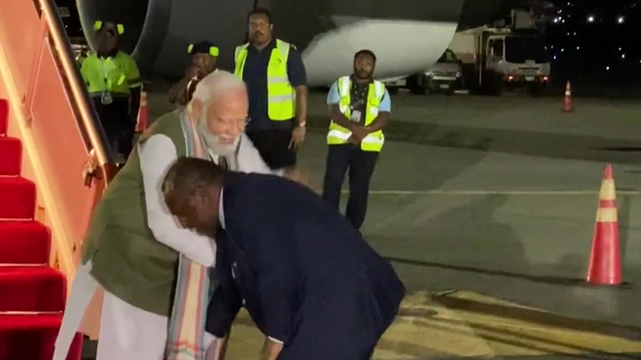 As a mark of respect, the PM of Papua New Guinea touches the feet of PM Modi! - PM Visit