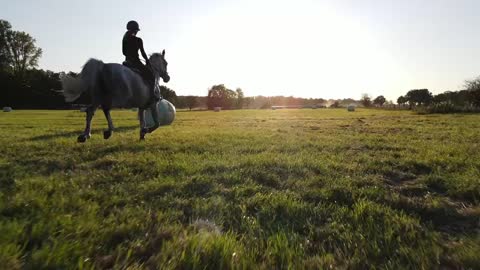 Sexy Lady is Riding with the Horse Fast