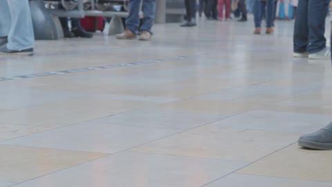 CU Feet walking in busy train station