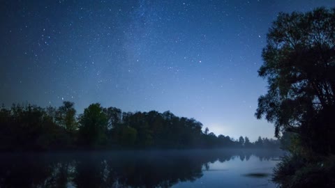 River flowing in a forest under the stars