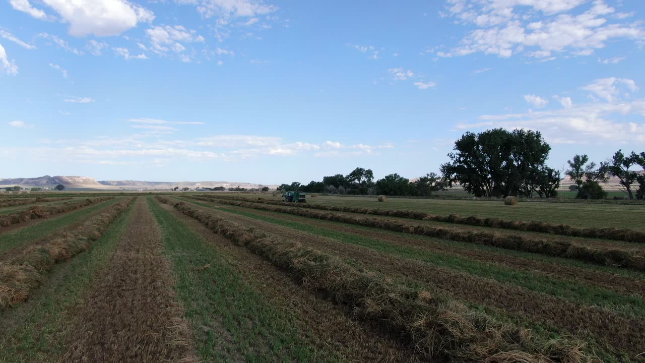 Fly along field to older baler