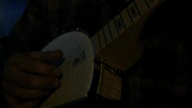 Playing banjo at dusk