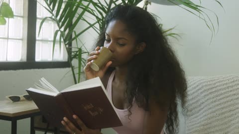 Sexy black girl reading a book