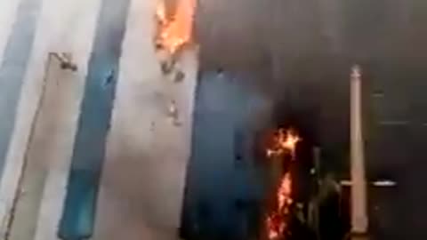 The Central Bank of Sudan burns in the capital, Khartoum, due to intense fighting.