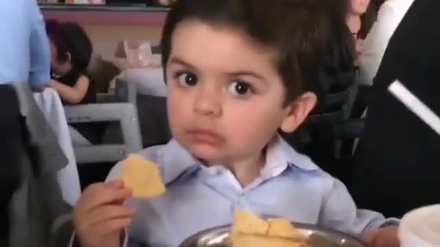 Little boy get angry after stealing his food and showing a cute face