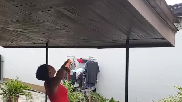 Lady yells greetings to her neighbors during quarantine