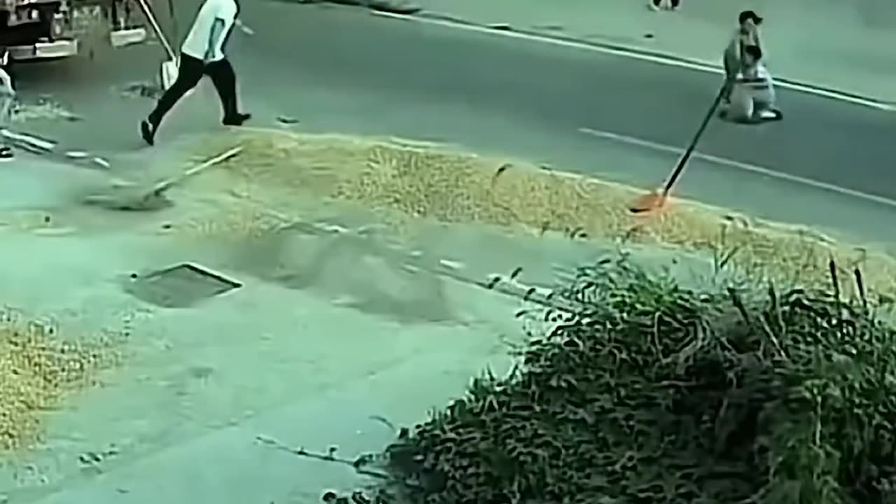A small boy runs under a vehicle. But, luckily he gets saved.