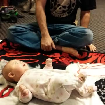 Dad Makes It Appear That His Baby Daughter Is A Squeaky Toy