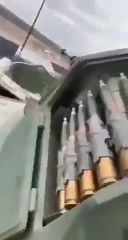 Locals playing with russian tank