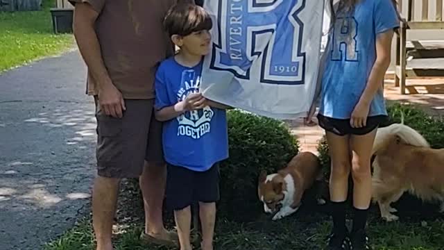 Corgi Interrupting Family Photo