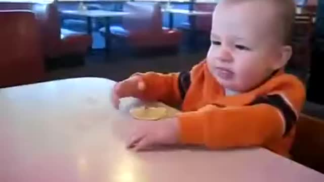 This baby takes his first lemon