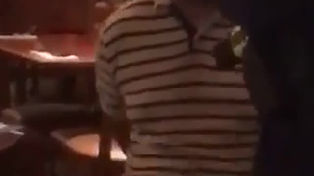 Handcuffs guy in restaurant falls over backwords in chair