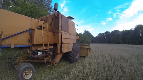 Main view on harvester during work at summer time