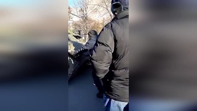 Ukraine.Unarmed Civilians stop the Russians with their bare hands in the village