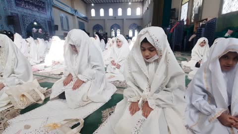 Muslim girls praying