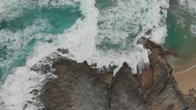 relaxing waves breaking against the shore