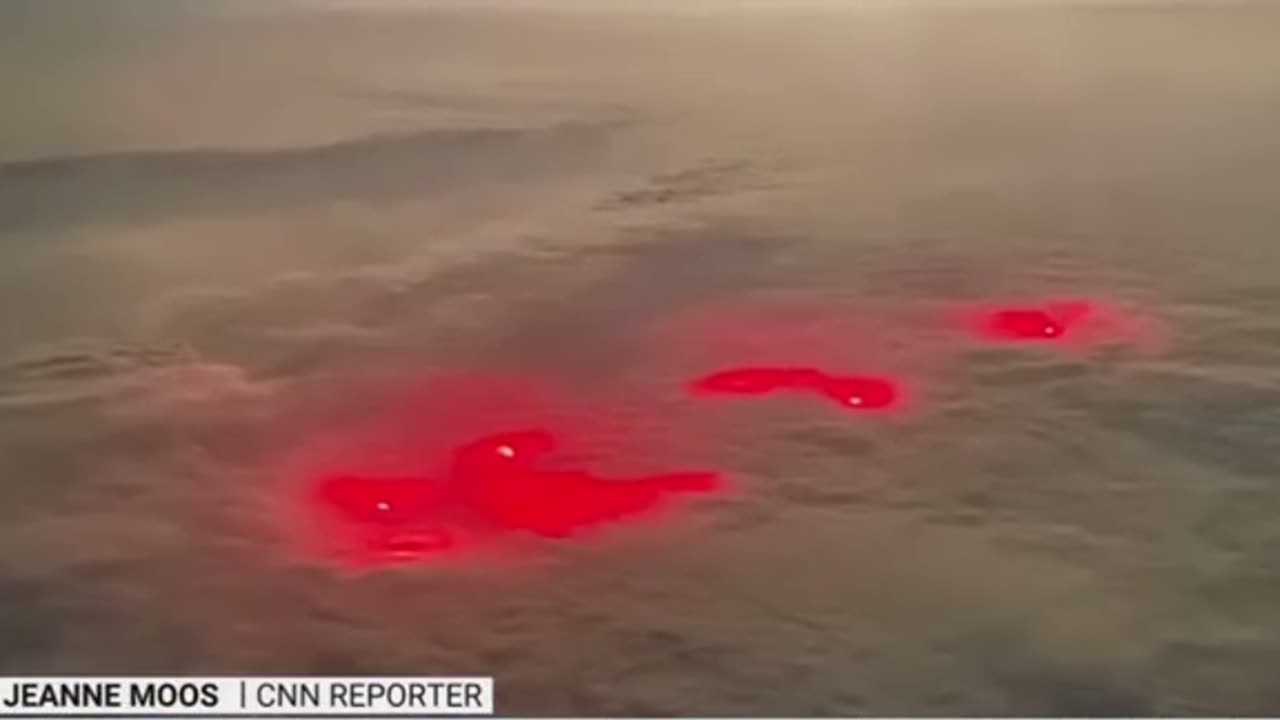 A strange red glow was filmed by a pilot as he traveled over the oacific ocean