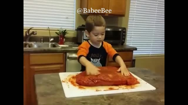 Baby Helping Dad with the Brisket