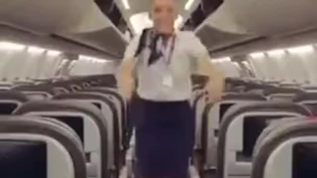 Russian Air Hostess Closes Plane s Luggage Flaps With Her Legs.