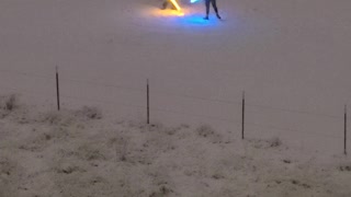 Couple Has a Light Saber Duel in the Snow