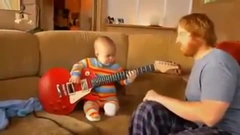 Baby playing guitar like pro😅