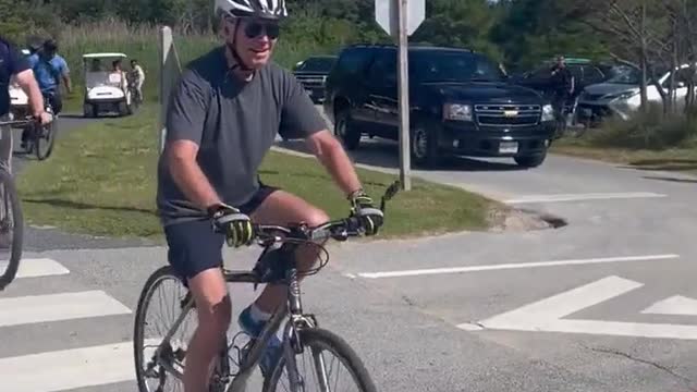WATCH: Joe Biden falls down on bicycle
