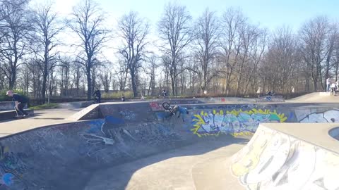 Blue hoodie bike faceplant graffiti