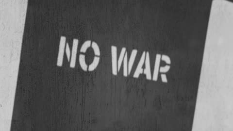 Stencil Board Show A "NO WAR' Statement From Its Projected Shadow Off The Wall