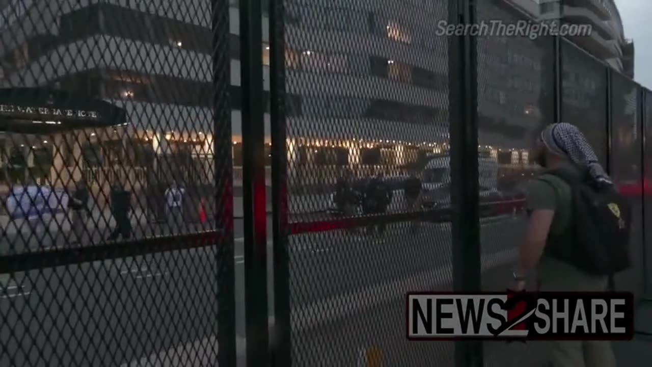 Hamas supporter in front of the Watergate Hotel yells at Israel supporters